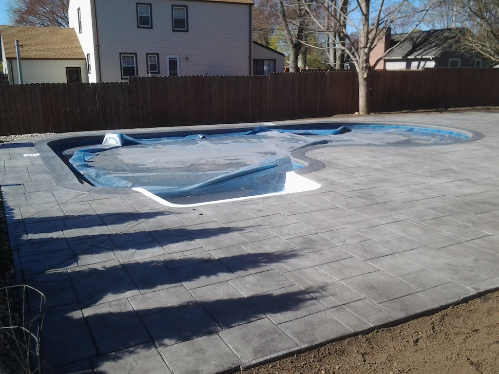 Swimming pool and stamped concrete project example 140